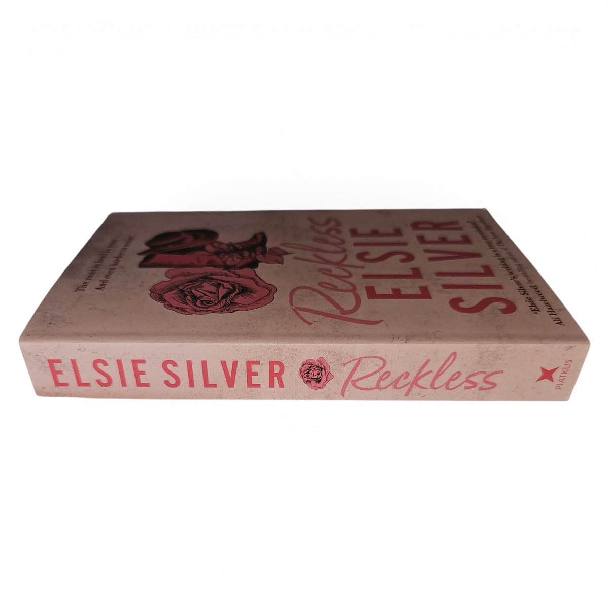 Reckless by Elsie Silver on a clean white background.  A small town cowboy spicy romance. 
