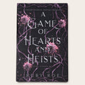 The book cover of 'A Game of Hearts and Heists' by Ruby Roe, featuring a dark background with purple vine patterns and pink flowers, displayed on a light beige background.