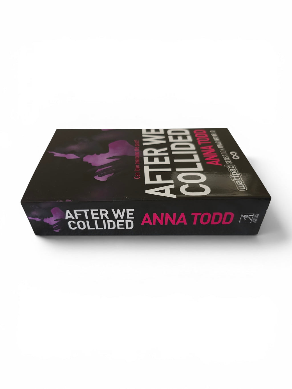 A boxed media product titled "After We Collided" by Anna Todd, shown at an angle on a clean white background. The box is predominantly black with large white title text, pink author text, and a purple abstract graphic on the cover.