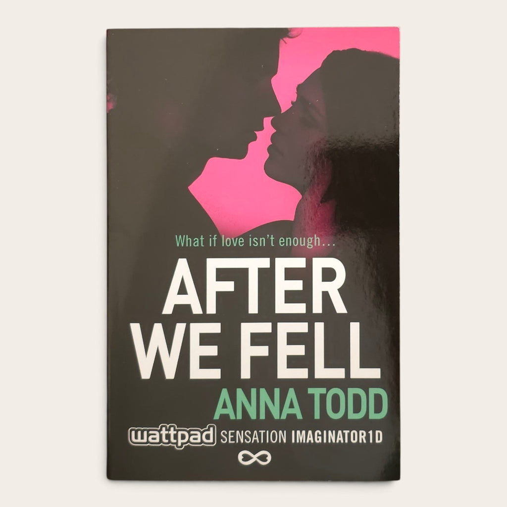 A book cover for 'After We Fell' by Anna Todd, featuring a dark gray background with a bright pink silhouette of a couple's faces and bold white and green text. The Wattpad logo is visible at the bottom.