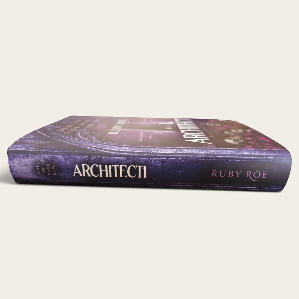 The book 'Architecti' by Ruby Roe, featuring a dark purple and black cover with white title text, shown on a light beige background.