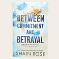 Book cover for 'Between Commitment and Betrayal' by Shain Rose, featuring a light blue and white textured background with a gold ring and diamond illustration and blue floral accents.
