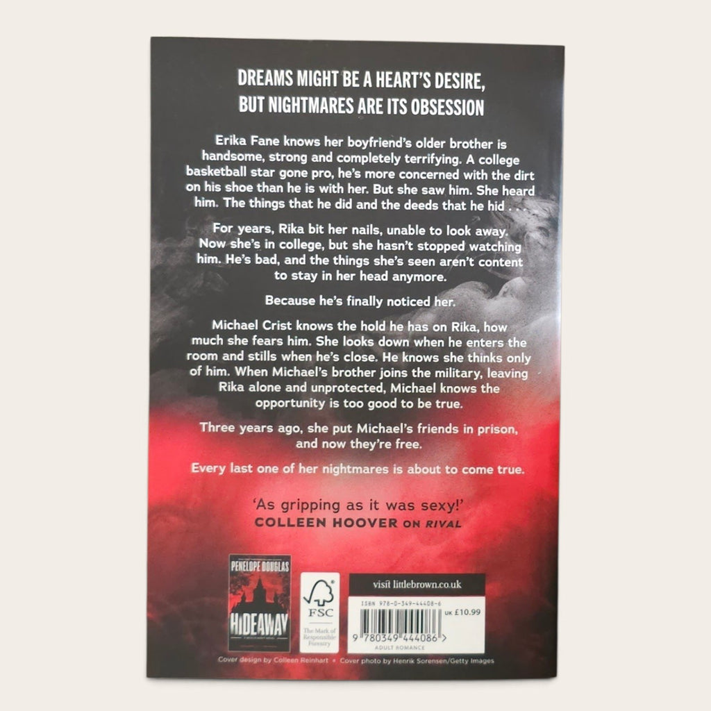 The back cover of the paperback book Corrupt' by Penelope Douglas, featuring a dark gray background with white text and a red smoky gradient at the bottom.