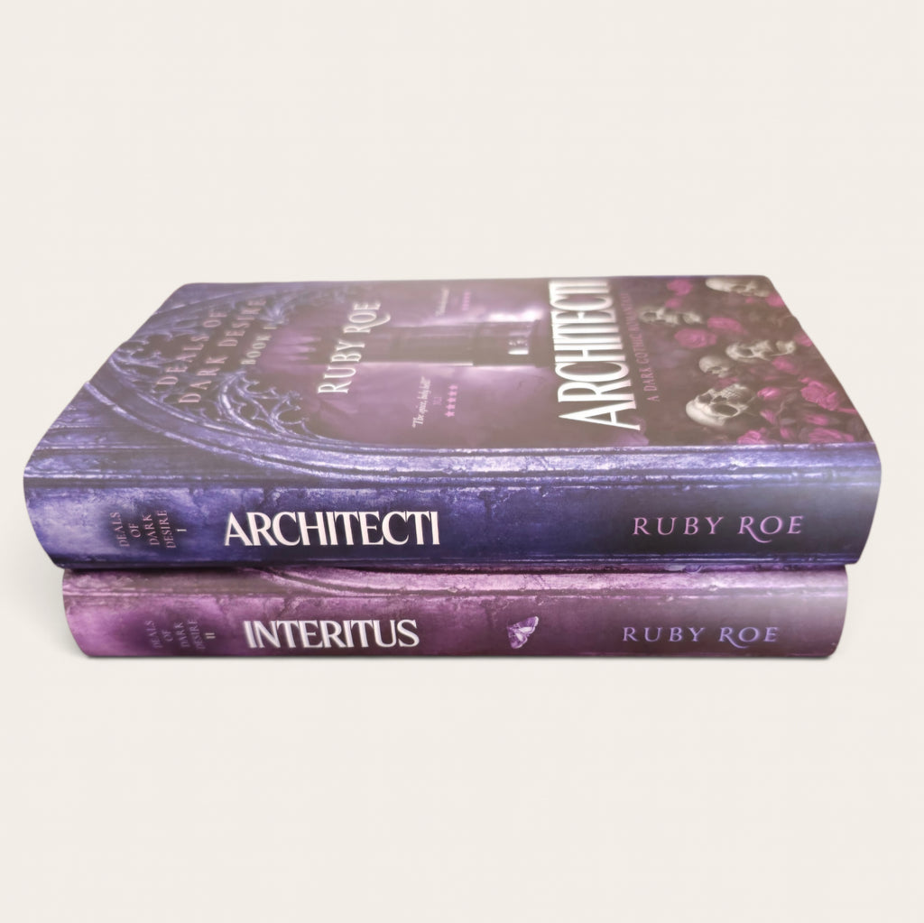 Two hardcover books, Architecti Volume 1 and Volume 2 of the Interitus series by Ruby Roe, stacked on a light beige background.