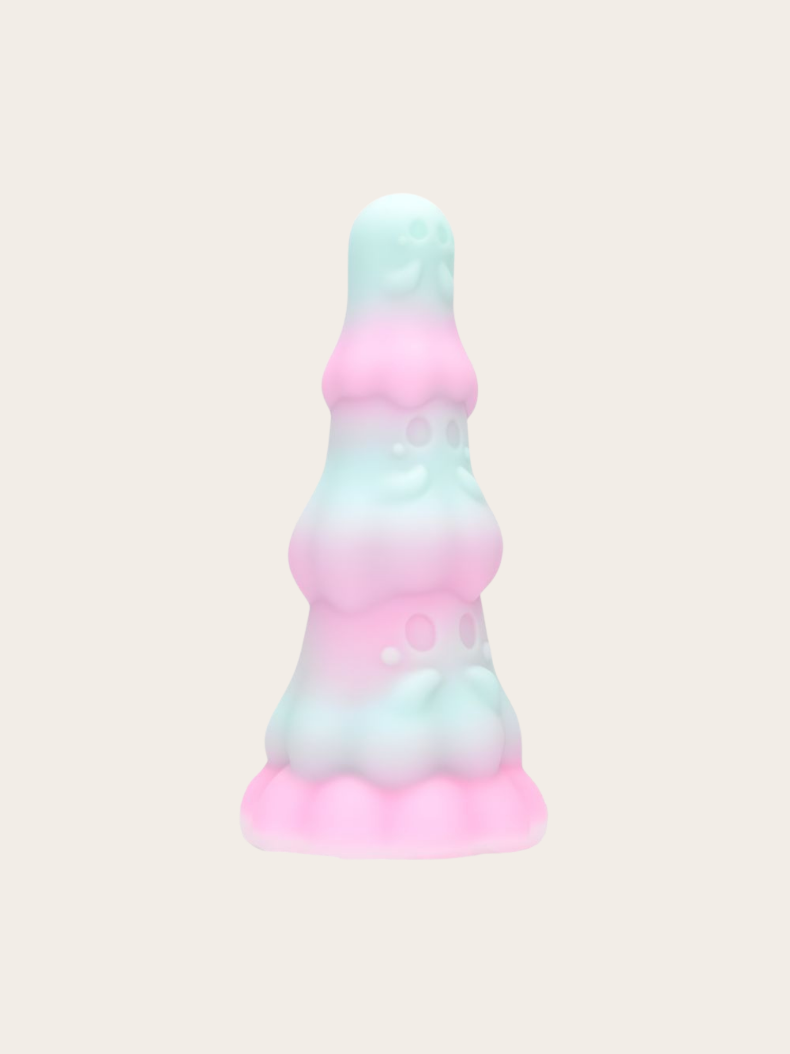 A pastel gradient dildo with a smooth, matte finish, featuring a color transition from mint green to light pink and back to mint green, set against a solid off-white background.