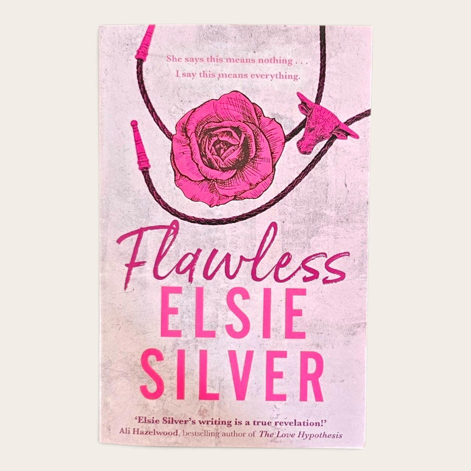 Book cover for 'Flawless' by Elsie Silver, featuring a pink rose and a small bird on a light pink textured background with bold pink title text.