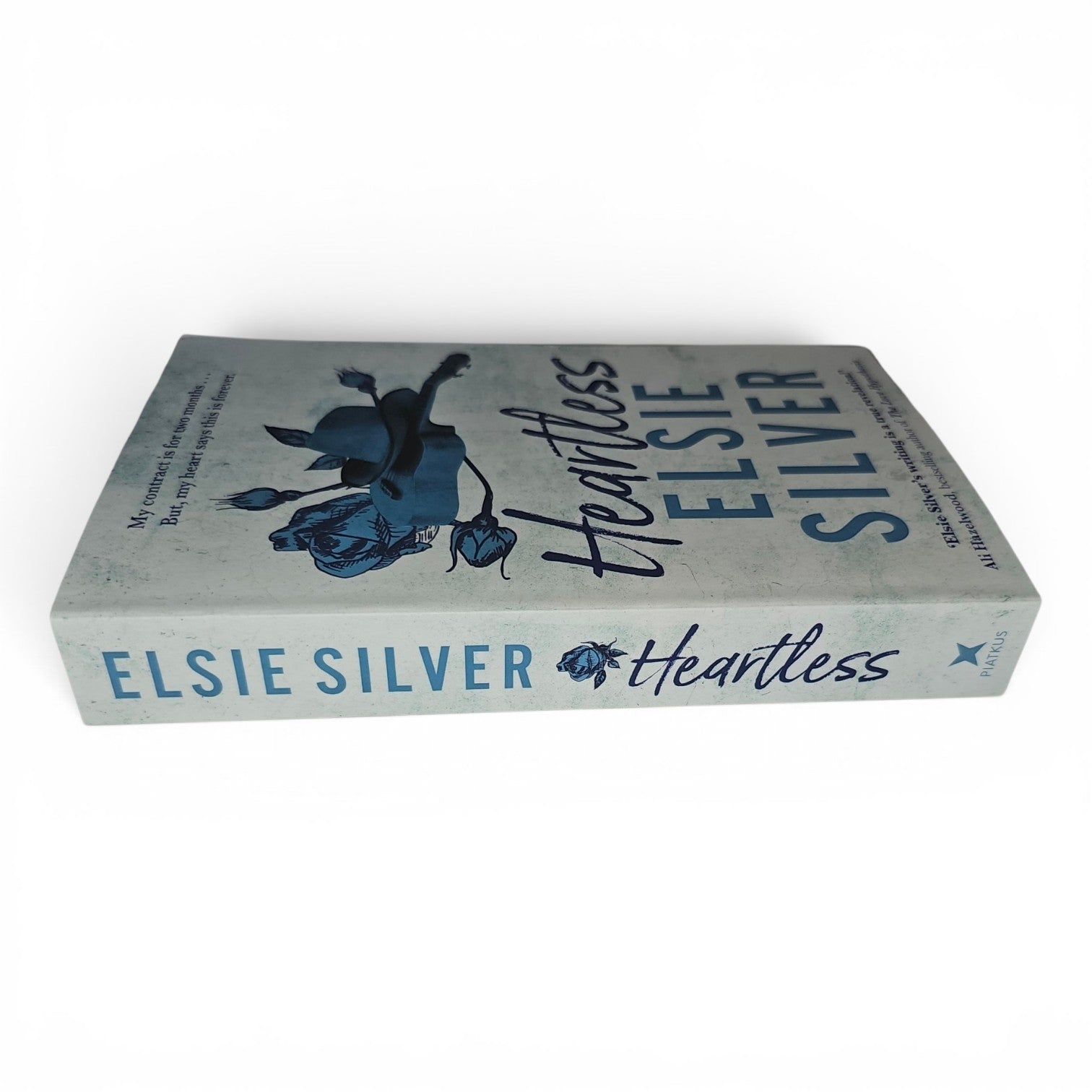Heartless by Elsie Silver on a clean white background.  A small town cowboy spicy romance. Nanny Romance. 