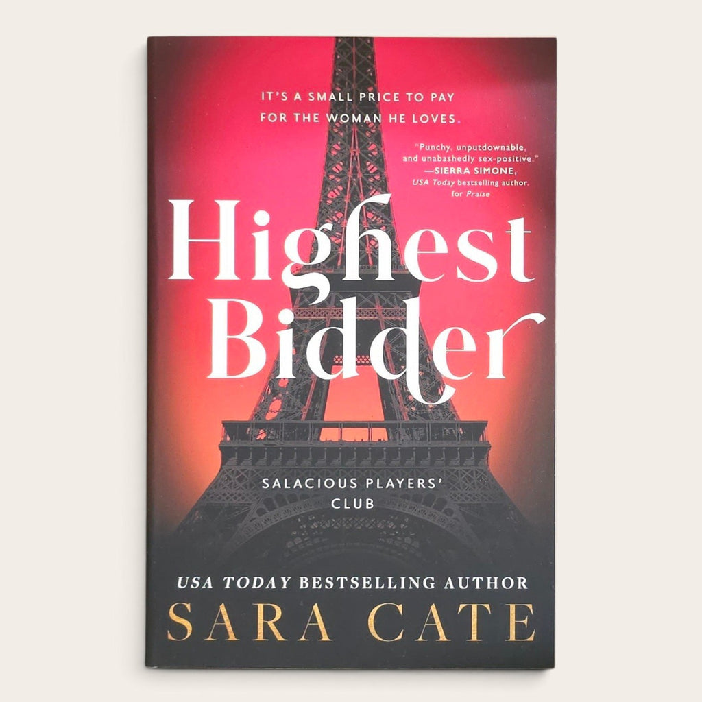 Book cover of 'Highest Bidder' by Sara Cate, featuring a red and black gradient background with a large Eiffel Tower silhouette and white title text.