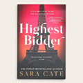 Book cover of 'Highest Bidder' by Sara Cate, featuring a red and black gradient background with a large Eiffel Tower silhouette and white title text.