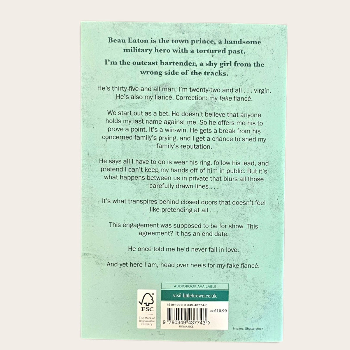The back cover of a book, featuring a light teal background with black text, a barcode, and a green publisher label at the bottom.