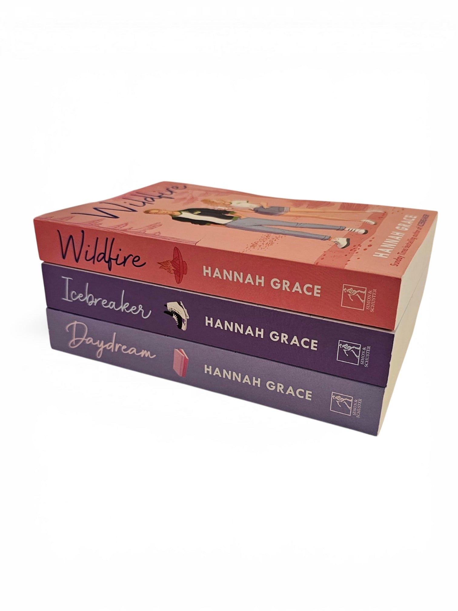 A boxed set of three paperback books by Hannah Grace titled 'Wildfire', 'Icebreaker', and 'Daydream' stacked on a white background. The top book has a coral-red cover with an illustration, and the bottom two books have purple covers.
