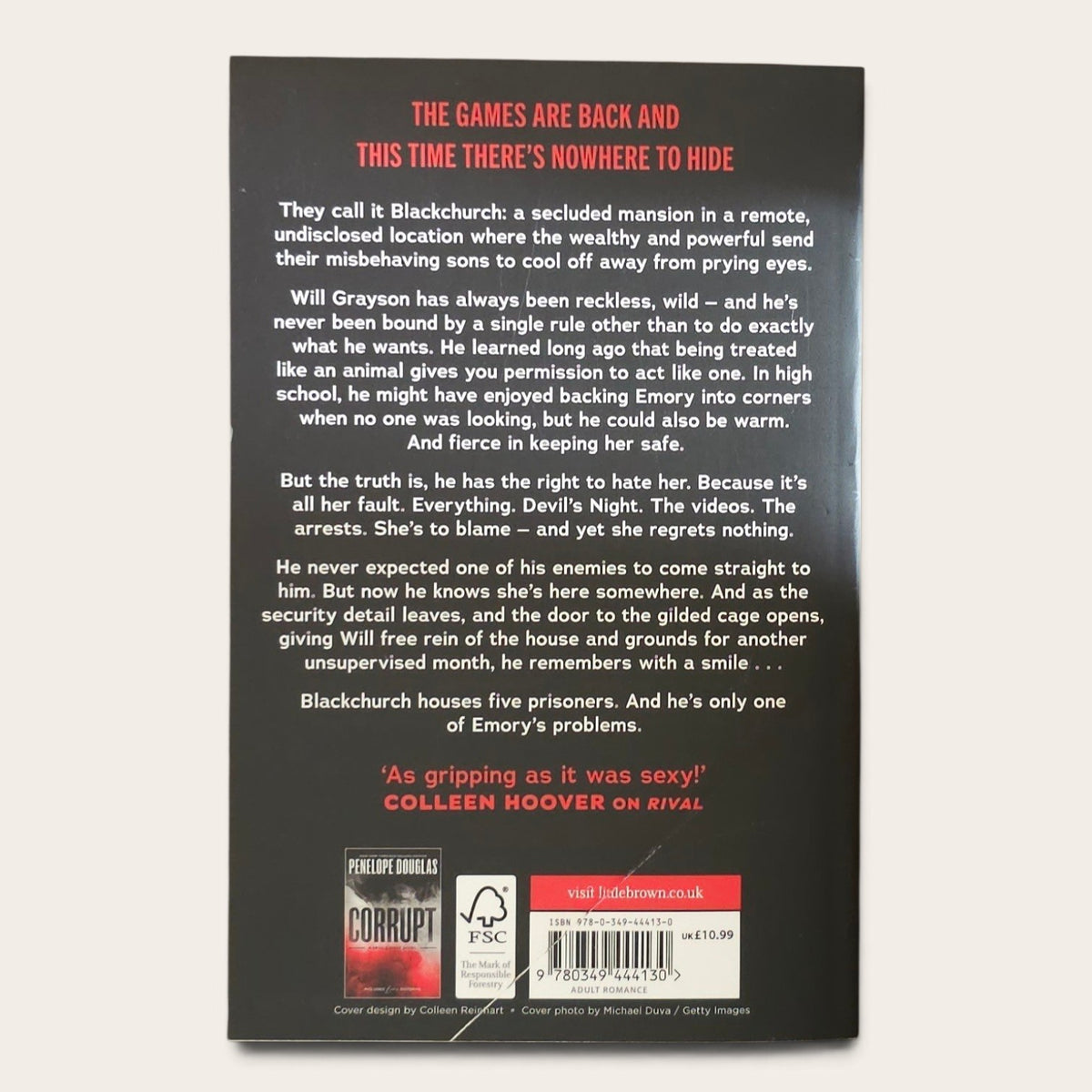 The back cover of the paperback book 'Nightfall' by Colleen Hoover, featuring a dark gray background with white and red text, a barcode, and publisher logos including PSC and Faber & Faber.
