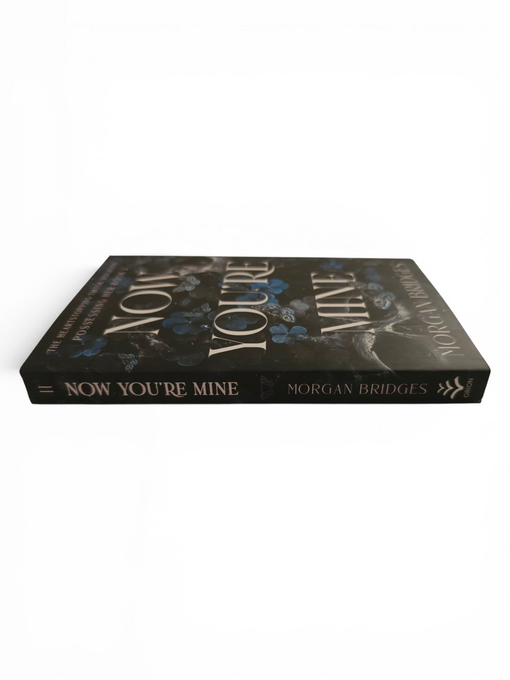 A paperback book titled 'Now You're Mine' by Morgan Bridges, displayed at an angle on a clean white background.