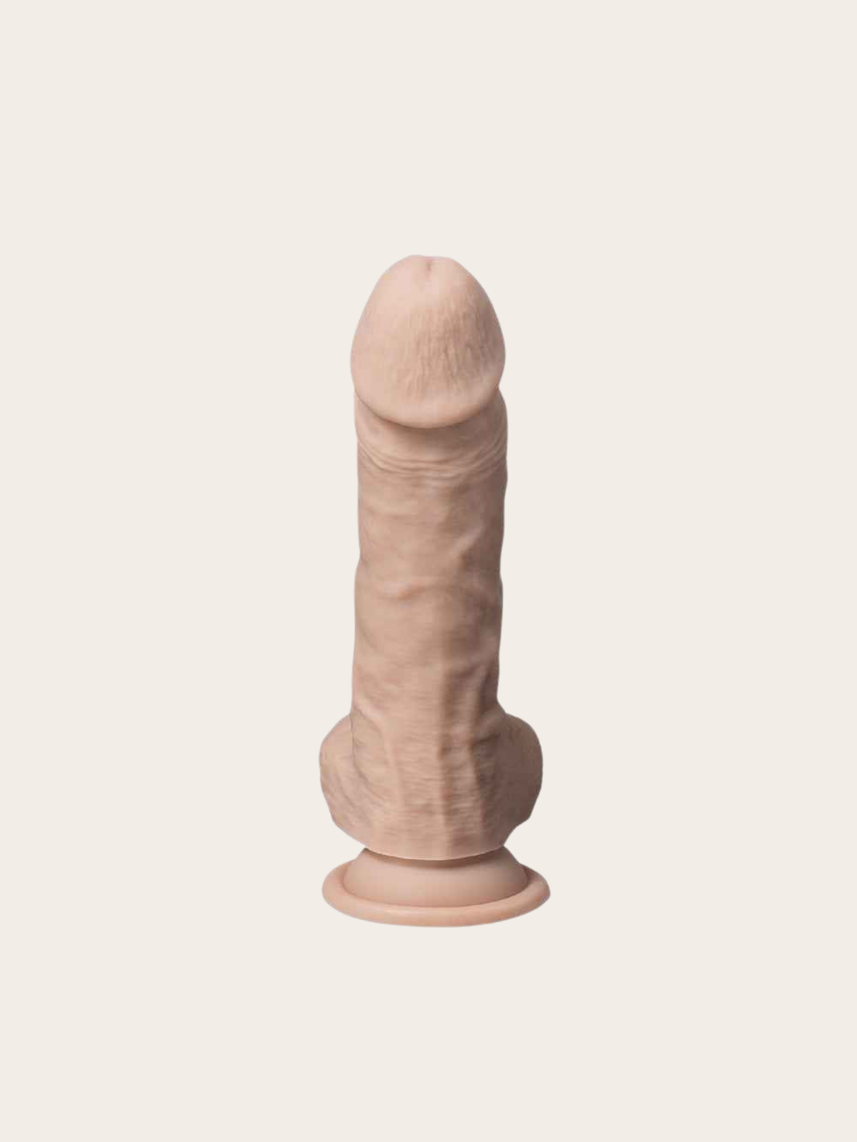 A realistic silicone dildo with a textured shaft and flared base, shown from the back on a solid off-white background.