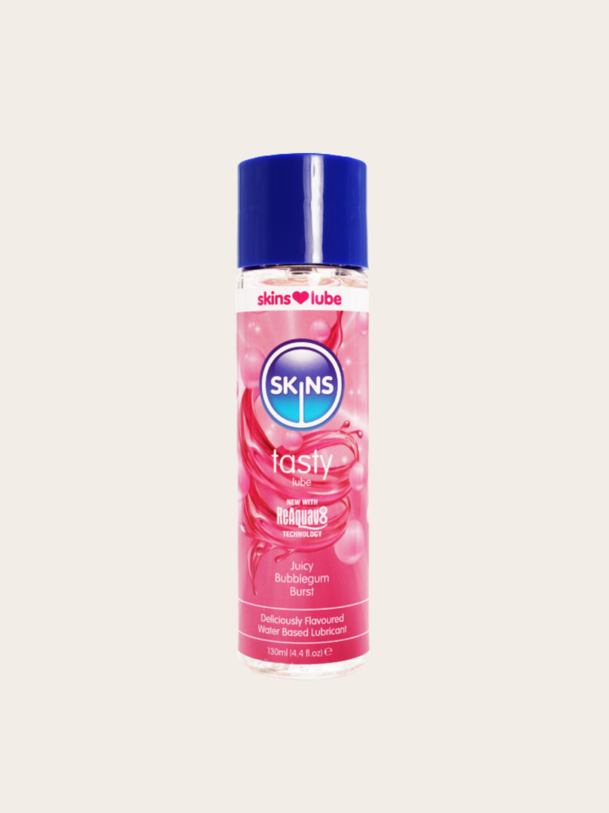 A bottle of SKINS lube Tasty Bubblegum Burst water based lubricant, featuring a pink label with bubble graphics and a dark blue cap, centered on a light beige background.