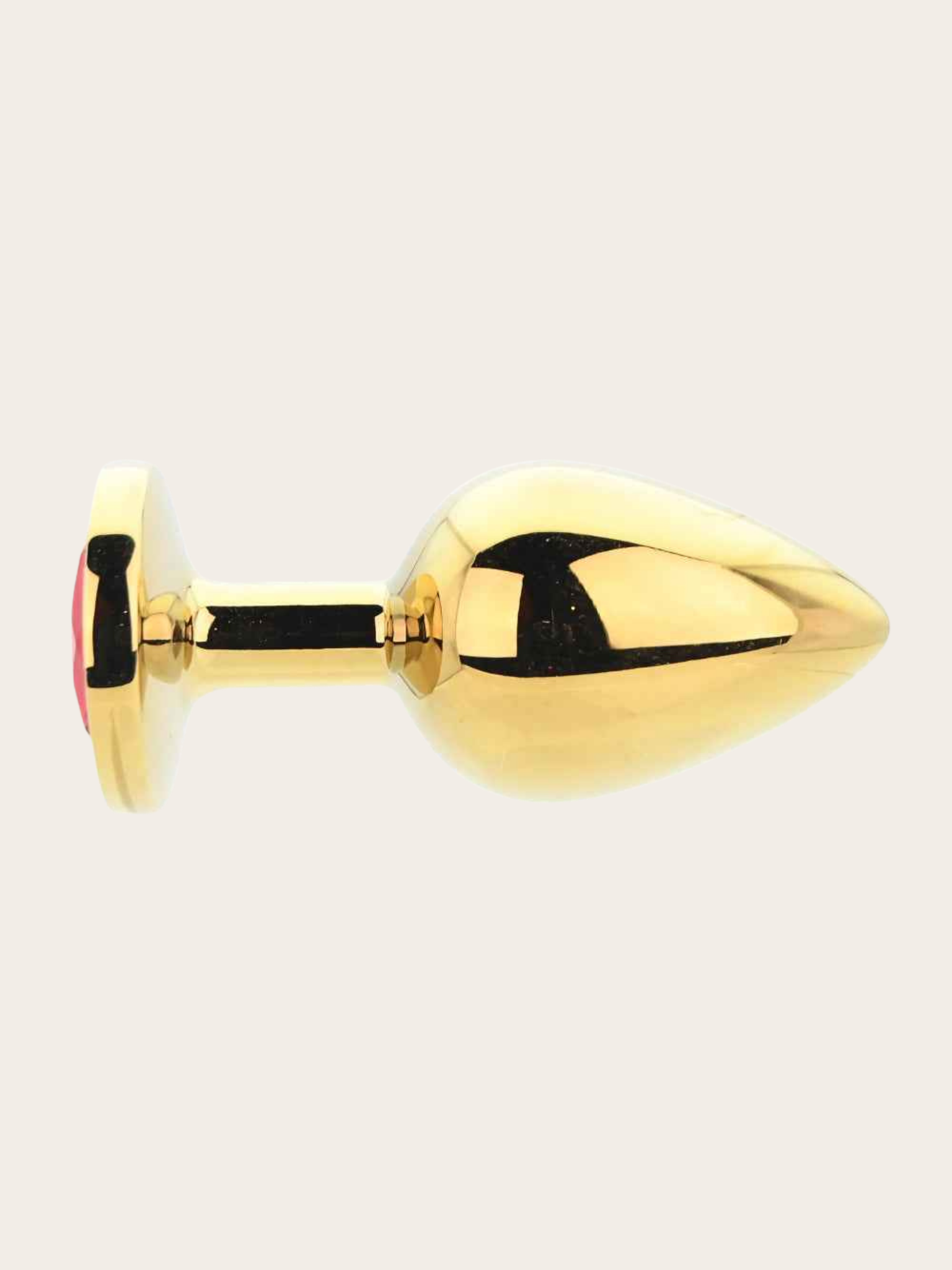 A polished gold metal butt plug with a smooth, rounded bulbous tip and a circular base featuring a small red accent, shown against a solid off-white background.