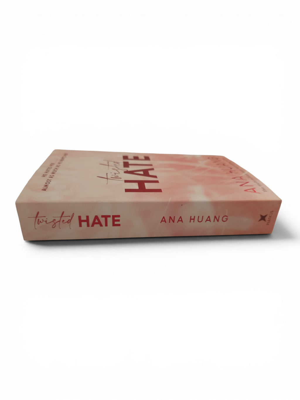 Twisted HATE book by Ana Huang, featuring a light pink and peach cover with bold red typography, shown on a clean white background.