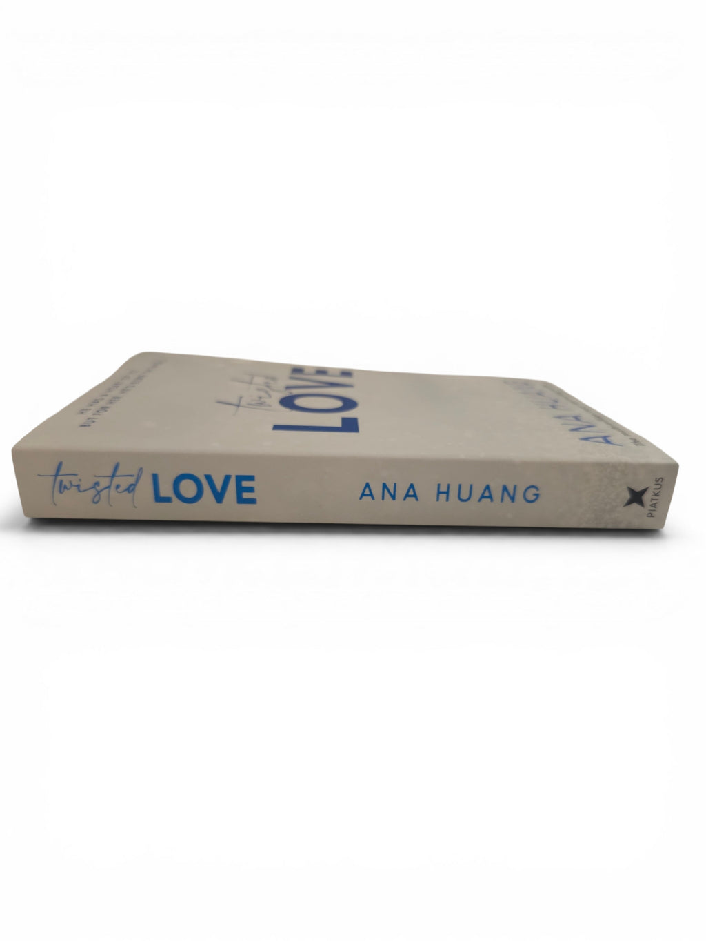 Twisted Love paperback edition book by Ana Huang, featuring blue text against a plain white background.