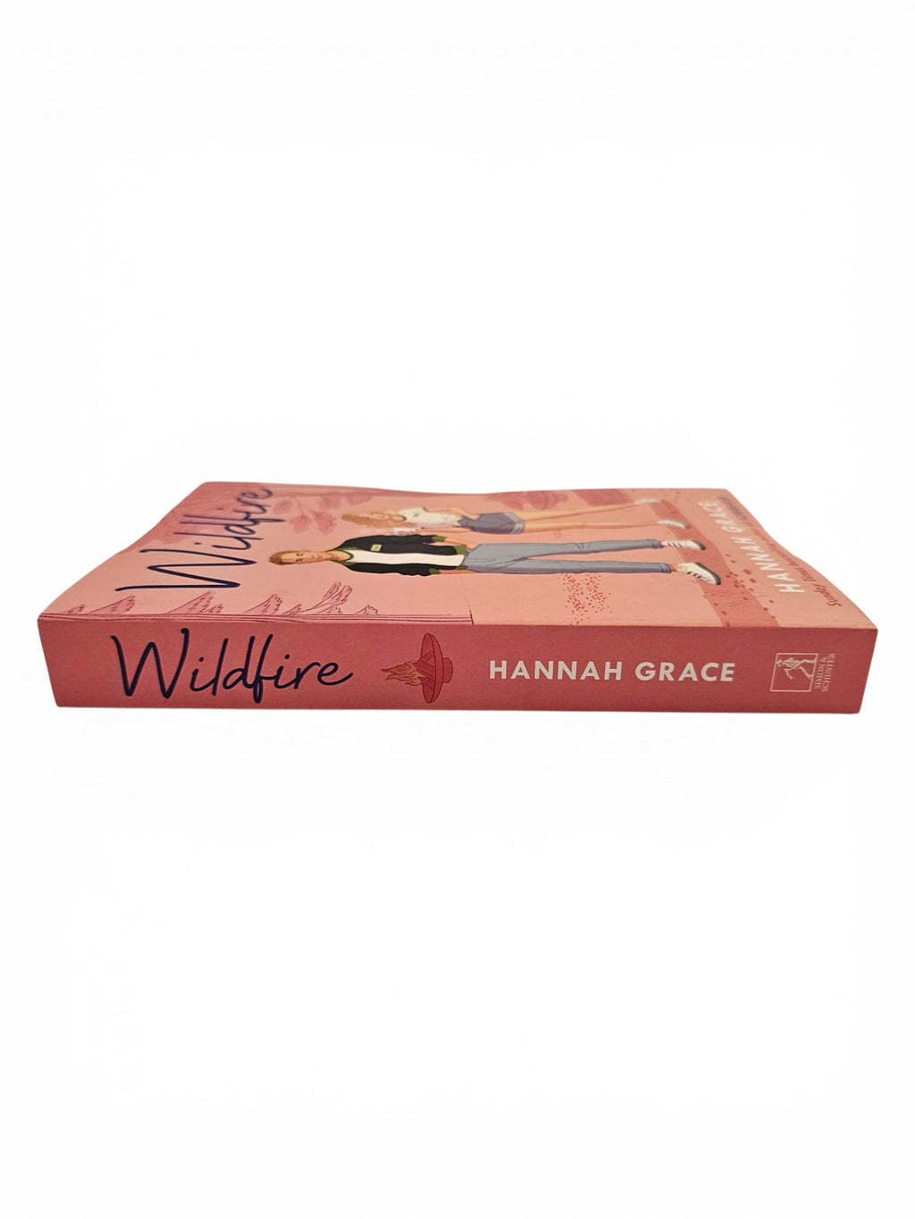 The book 'Wildfire' by Hannah Grace, featuring a dusty rose pink cover with an illustration of a women and man and black script title text, shown on a plain white background.